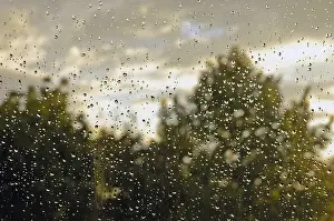 Rainy Evening Atmosphere Prints: Raindrop on window pane, Germany