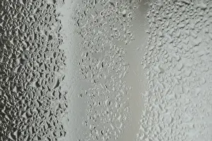 Deserted Rainy Scene Prints: Raindrops on window glass on blur grey background