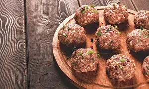 Meat Preparation Techniques Prints: Raw meatballs, with micro greenery