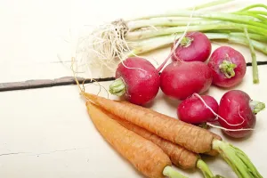 Vegan Nutrition Food Prints: Raw root vegetable on a rustic white wood table