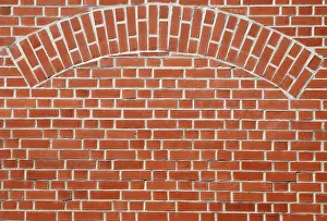 Deserted Building Architecture Prints: Red brick wall with an arch