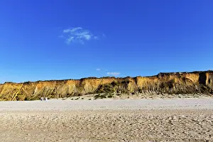 Steep Cliff Overlooking The Sea Prints: Red cliff in the evening light