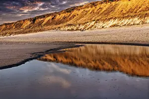 Coastal Area Schleswig Holstein Prints: Red cliff reflected in the water