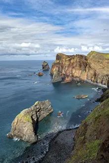 Steep Cliff Face Europe Prints: Red cliffs and rocks in the sea
