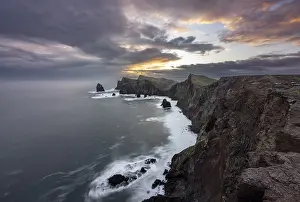 Atmospheric Evening Light Photos Prints: Red cliffs and rocks in the sea