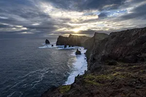 Deserted Coastal Area Photos Prints: Red cliffs and rocks in the sea