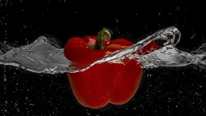 Bell Pepper Plant Prints: A red pepper falls through a water surface and creates a vortex