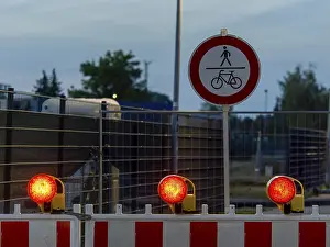 Deserted German Street Scene Prints: Red warning lights and warning barriers