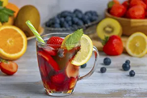 Orange Colored Beverages Prints: Red wine with strawberries, lemons and oranges