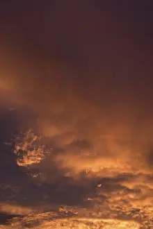Cloudy Skies Southern Europe Prints: Reddish clouds in the evening sky