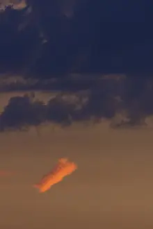 Cloudy Skies In Bavaria Prints: Reddish small cloud in evening light