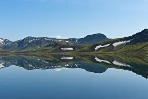 Blue Sky Daytime Photography Prints: Reflection in the still lake, remnants of snow