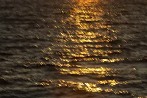 Water Surface Reflections Prints: Reflections of the setting sun on the water surface