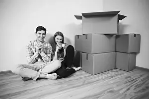 Interior Space Photo Prints: Relocated couple drinking tea on the floor