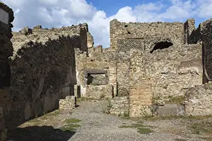 Pompeii Ruins Prints: Remnants of old terracotta brick and stone wall structures with rectangular