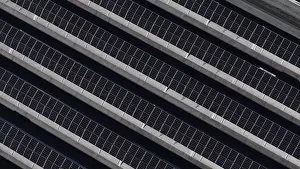 Ecofriendly Power Supply Prints: Repetitive diagonal pattern of solar panels on a rooftop