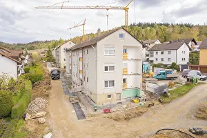 Residential Construction Germany Prints: A residential development under construction with cranes in the background