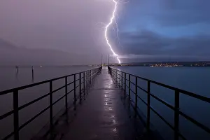 Lightning Strike Germany Prints: Retreating thunderstorm, left, and magic hour with lightning