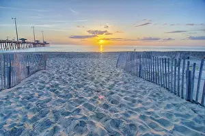 American Coastal Landscapes Prints: The rising sun peeks through clouds