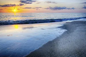 American Coastal Landscapes Prints: The rising sun peeks through clouds