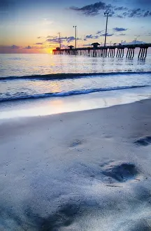 Outer Banks North Carolina Prints: The rising sun peeks through clouds