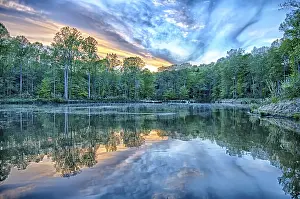 Uninhabited Cloudy Skies Prints: River reflection of clouds over wide angle