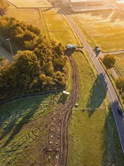 Atmospheric Autumn Mood Photo Prints: Road through fields with construction