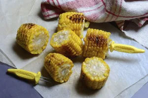 Barbecued Corn Prints: Roasted corn on the corn cob with corn on the cob holder