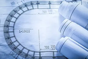 Construction Blueprint Design Prints: Rolled up construction plans on blueprint top view