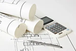 Construction Drawings Prints: Rolled technical drawings and a calculator