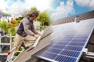 Framed Print : Roofer on Rooftop: Solar Panel Installation Print