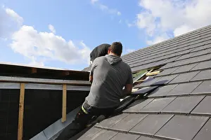 Roof Construction Prints: Roofer working on a new dormer window