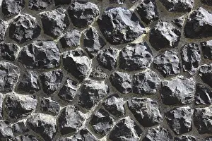 Distinctive Rock Formations Prints: Rough wall of black rocks with distinctive structure