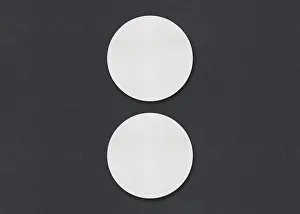 Gray Background Design Prints: Two round white sheets vertically aligned on a gray background