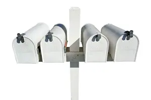 Plain White Background Prints: Row of white mailboxes isolated on a white background
