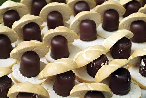 Calorie Rich Desserts Prints: Rows of chocolate marshmallows with rolls