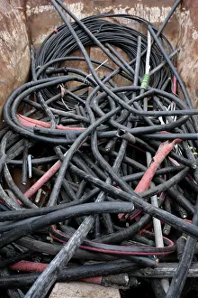 Ecofriendly Waste Disposal Prints: Rubber hoses in container in the scrapyard