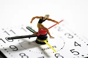 Clock Face Close Up Prints: Runner on a clock: time is running out