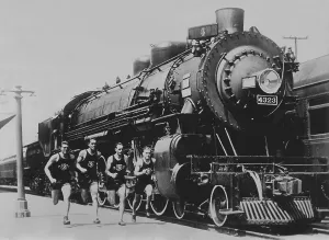 Old Steam Locomotives Prints: Runners and train in the 1930s