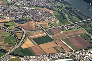 Prints of A rural landscape from above with fields, roads and a motorway that combines nature and infrastructure, view from an airplane of the Frankfurt countryside in Hesse Germany Aerial View Prints: Aerial View of Frankfurt Countryside Print