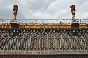 Unesco World Heritage Site In Germany Prints: Rusted industrial structure under a cloudy sky