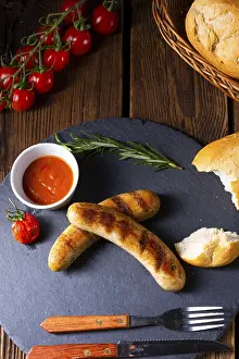 Bavarian Sausage Products Prints: Rustic bratwurst with ketchup and fresh rolls