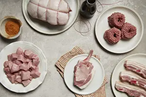 Gourmet Meat Dishes Prints: A rustic display of fresh meat cuts