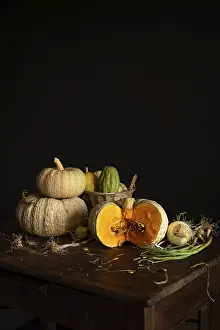 Wooden Table Photography Prints: A rustic still life featuring pumpkins