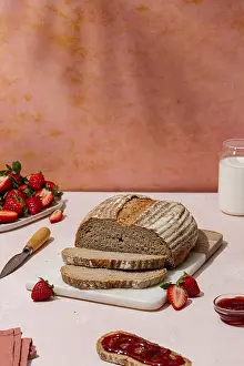 Homemade Jam Prints: A rustic loaf of bread is sliced on a cutting board