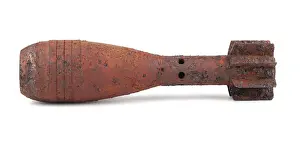 Studio Shot Of A Shell Prints: Rusty mortar shell isolated on white background