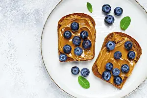 Rye Bread With Peanut Paste Prints: Rye bread with peanut paste and fresh blueberries