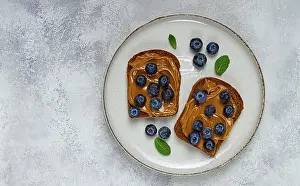 Rye Bread With Peanut Paste Prints: Rye bread with peanut paste and fresh blueberries