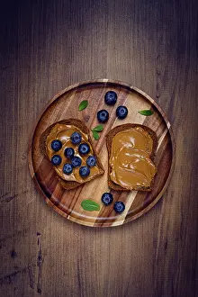 Homemade Rye Bread Prints: Rye bread with peanut paste and fresh blueberries