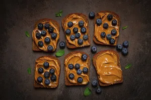 Rye Bread With Peanut Paste Prints: Rye bread with peanut paste and fresh blueberries